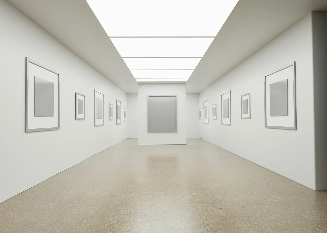 A pristine white gallery interior with empty frames on white walls, polished floors, and clinical overhead lighting
